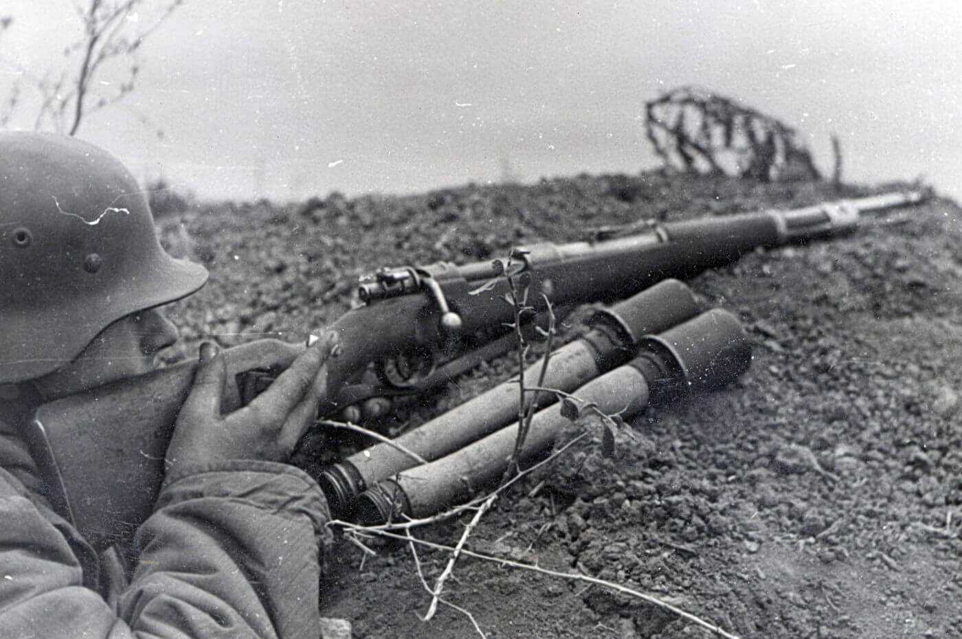 WWII soldier with a Mauser 98k bolt action military surplus rifle