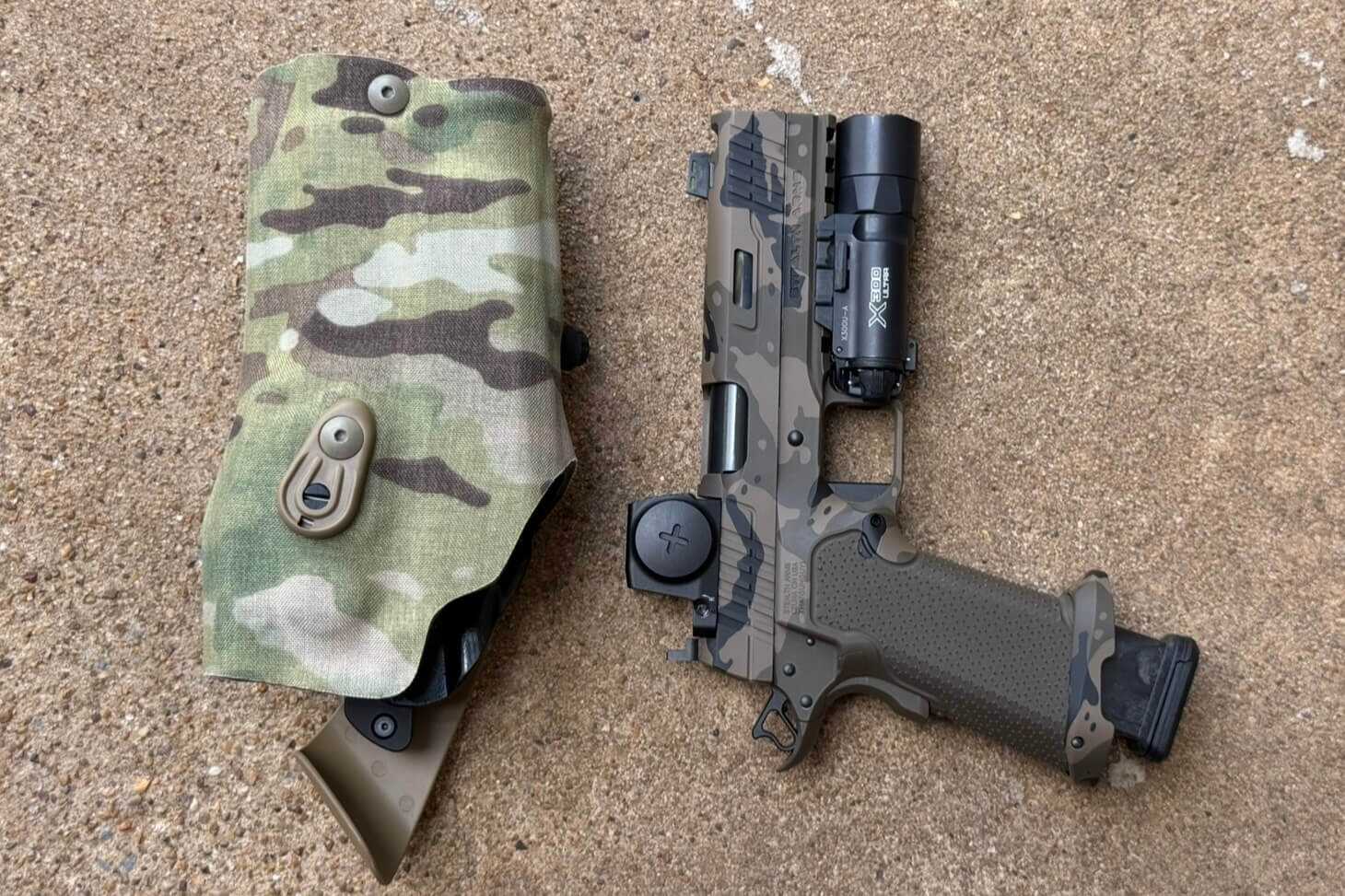 Staccato XC 2011 pistol with weapon light next to a Safariland duty holster