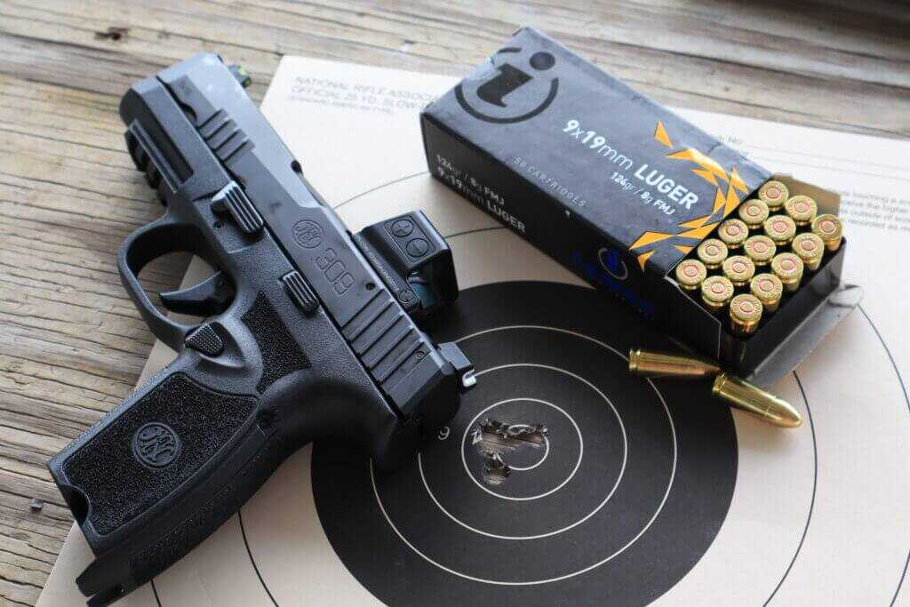 FN 309 MRD accuracy test target and ammunition after a ten-yard group