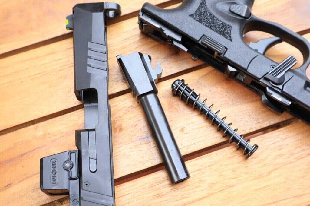 FN 309 MRD disassembled to show its internal hammer-fired operating system