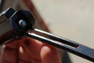 The rod on the back of the bolt carrier.  