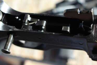 The trigger insides.  I can't think of an aftermarket that would fit in here and the SCR would benefit from a better trigger. 