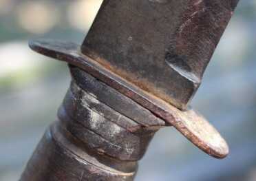 Kill-a-Bear with a Ka-Bar Knife? Any idea why the guard is bent back like this--toward the hand?