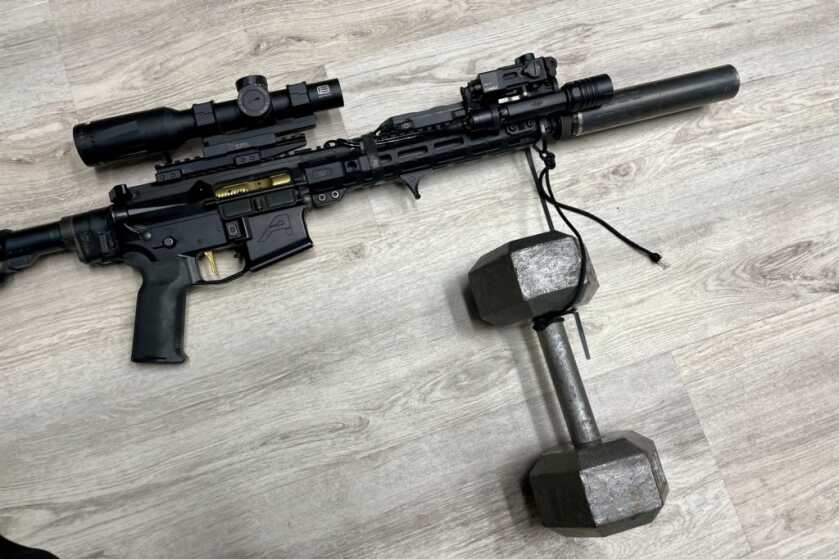 Midwest Industries Combat Rail deflection test using a 25lb dumbbell to measure laser POI shift