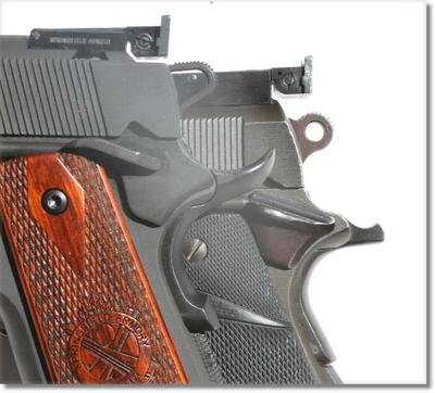 The grip safety on the RO has the bump at the end to insure a more positive release when you draw it quickly for competition. Behind it is a Remington Rand set up for competition with an old Bo-Mar sight. Note the difference in the thumb safety as well. The RO is a large flat paddle with grooves you just can't miss.