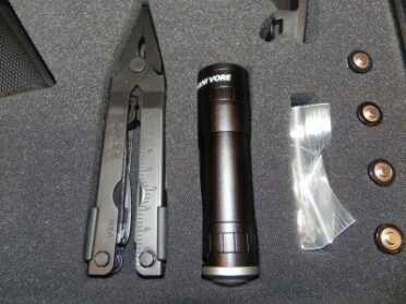 DSCN9478 In addition to a multi- tool and flashlight, the ESK has four spare AA batteries.
