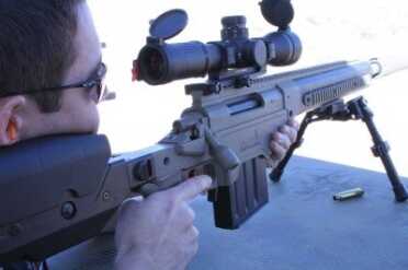ben-shooting Ben got to shoot this suppressed .338 Lapua Magnum at Media Day. APO does also make the suppressors by the way, but what we found really amazing was that this was a chassis product, not a custom rifle. We only saw the folding stock versions that day.