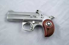 Bond Arms Derringer - Range Report & Factory Tour Snake Slayer IV with one of the optional bird’s head rosewood grips.