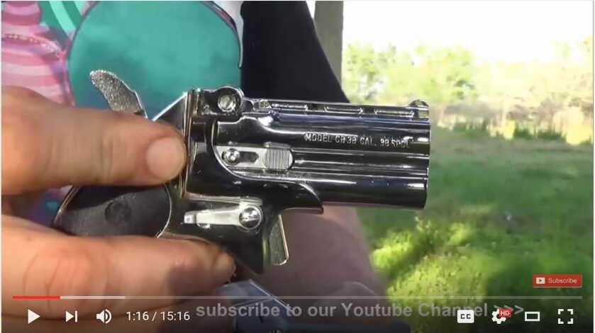 Cobra two-shot derringer with a box of .38 Special ammunition