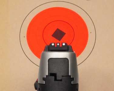 The black polymer sights have a white 3-dot pattern. The rear sight is adjustable for both windage and elevation.