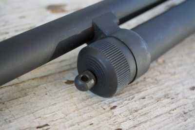 The magazine tube end cap has a swiveling sling attachment point.