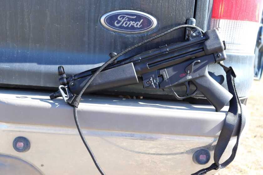 HK SP5 9mm pistol in its out-of-the-box configuration with the sling installed