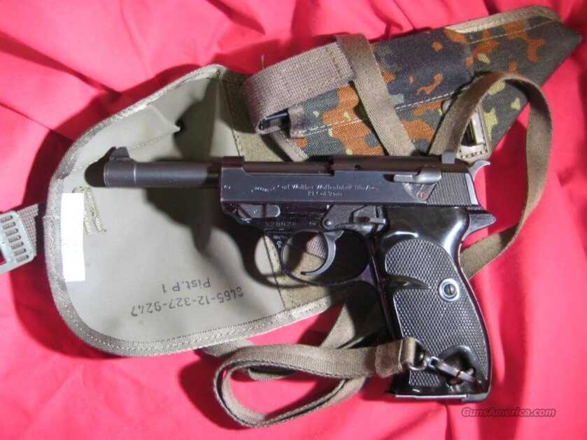 Walther P1 9mm pistol with a German flecktarn camouflage holster