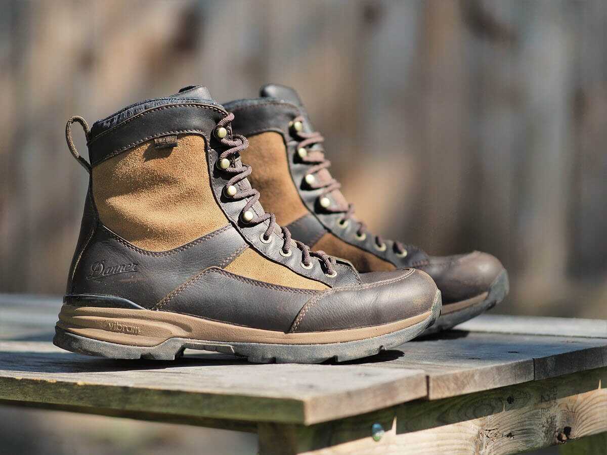 Danner Recurve hunting boots on a wood bench, best upland hunting boot 2026