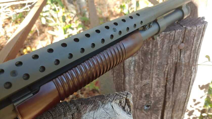 Ventilated heat shield on the barrel of a Mossberg 590A1 Retrograde shotgun