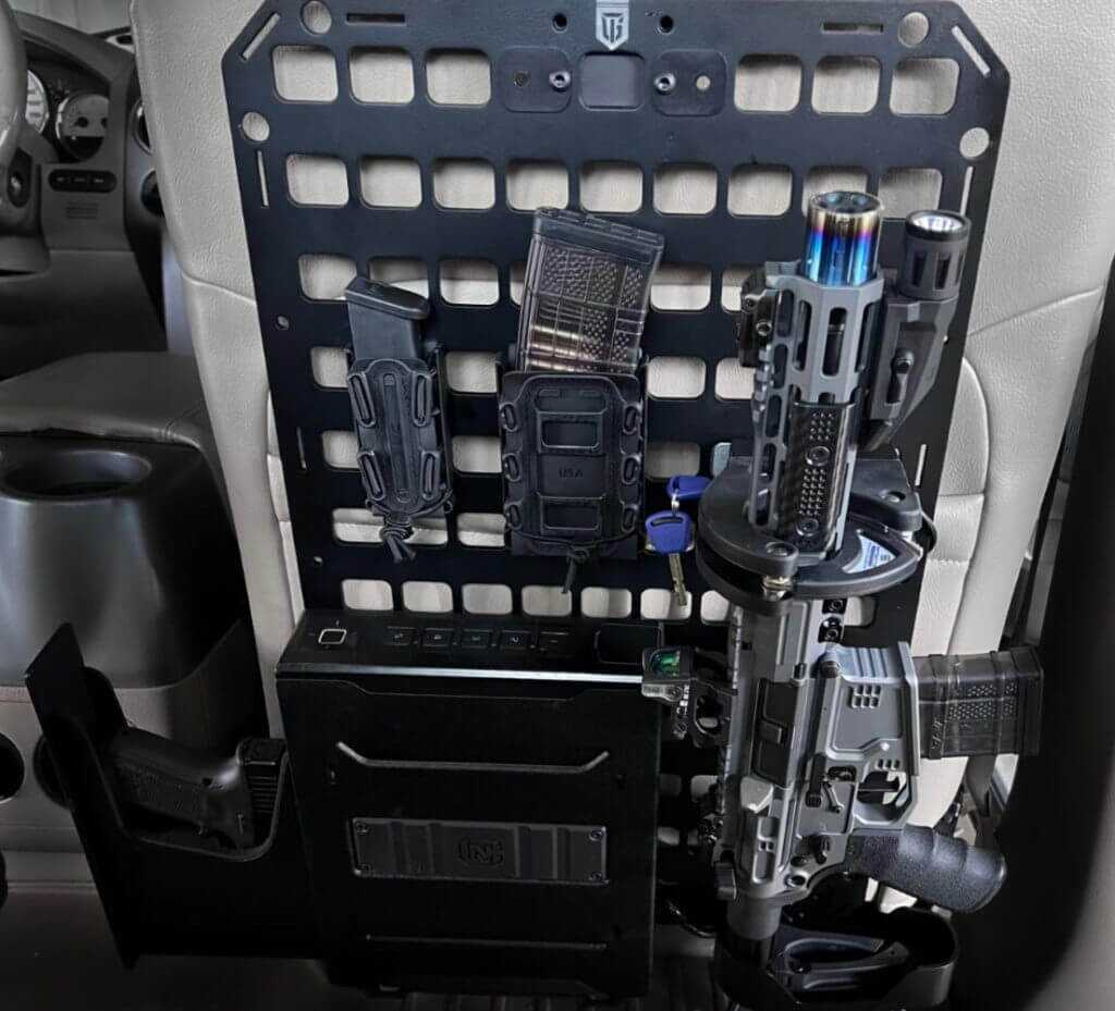 The pistol safe and locking rifle rack mounted to the backseat of a vehicle.