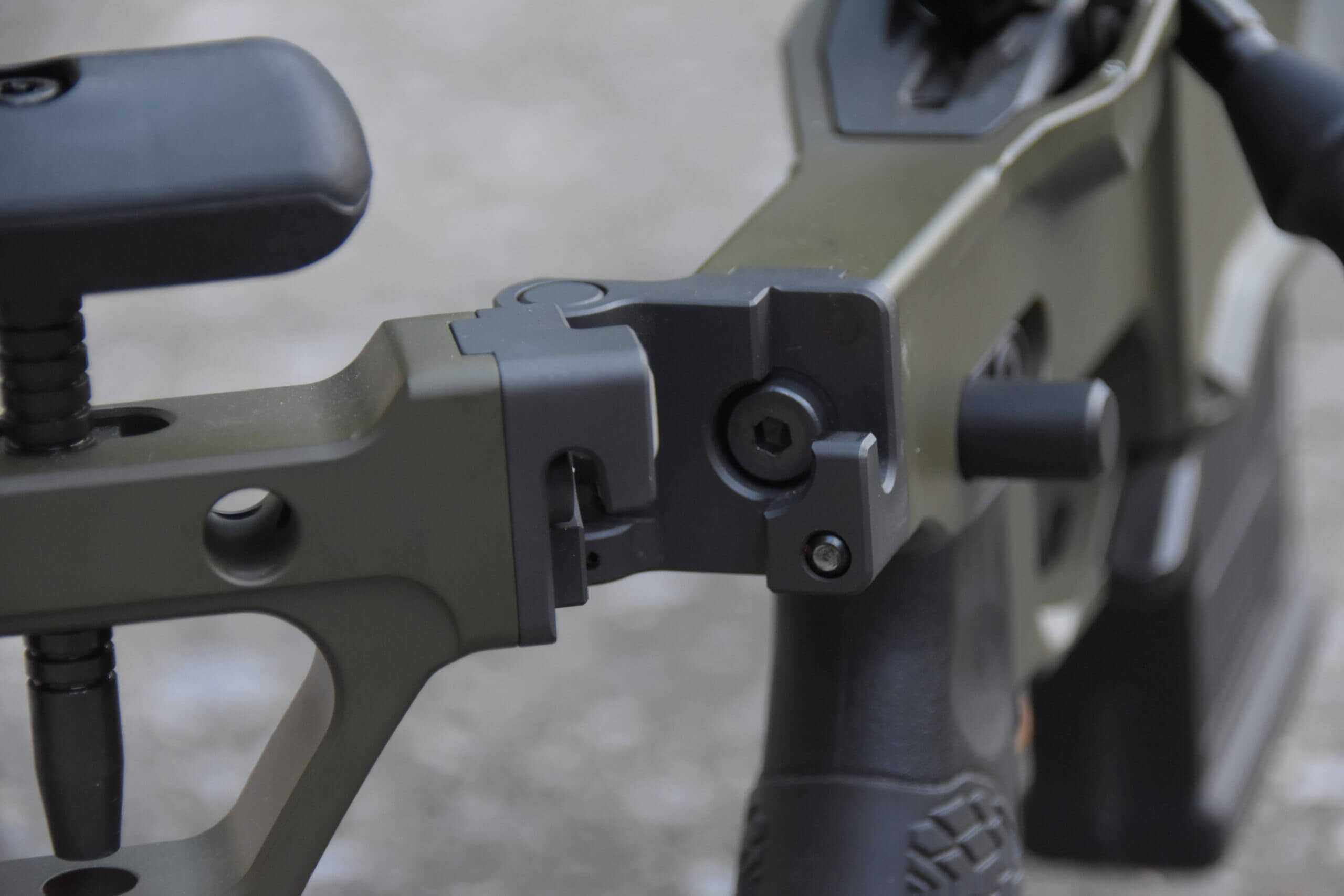 A closeup of the folding hinge on the Delta 5 Pro while the stock is in the half-folded position.