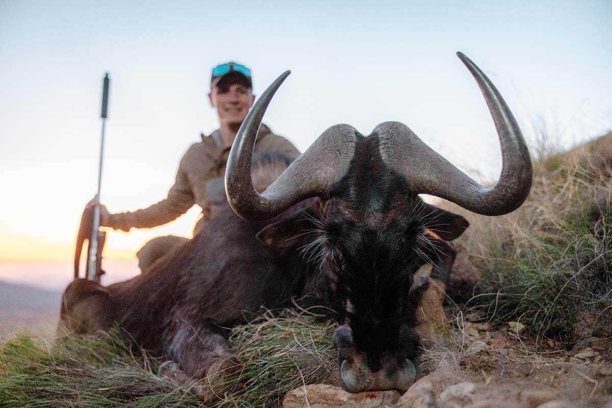 Hunter with a plains game trophy on a hunt in Dedito Luca boots, best travel hunting boot 2026