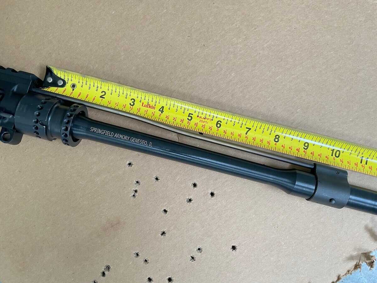 Tape measure along an AR-15 handguard showing the distance from receiver to gas block
