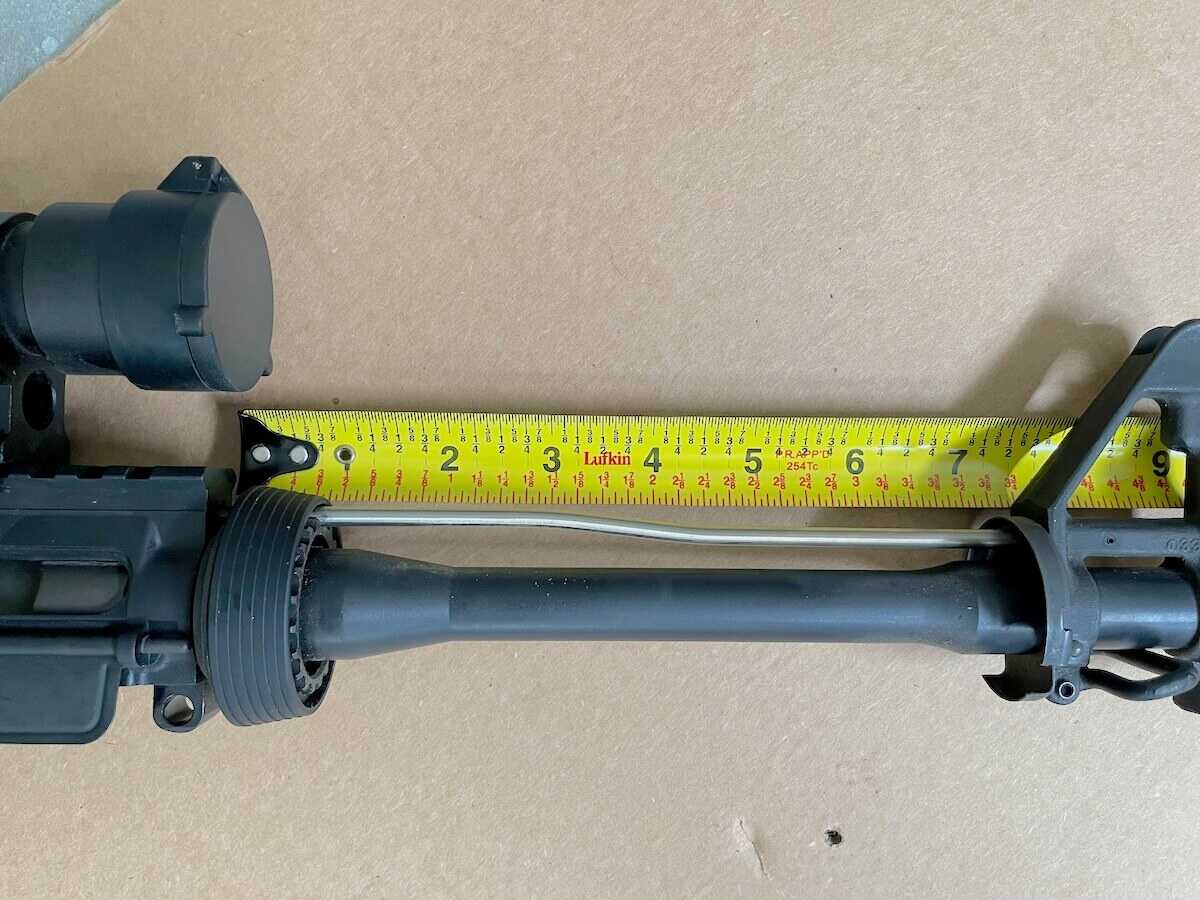 Measuring the gas system length on an AR-15 upper with a tape measure