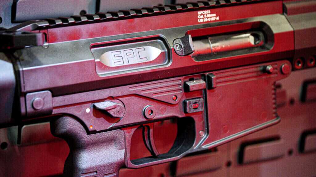Close up of the right side of the SPC Rifle showing the closed bolt and top of the grip.