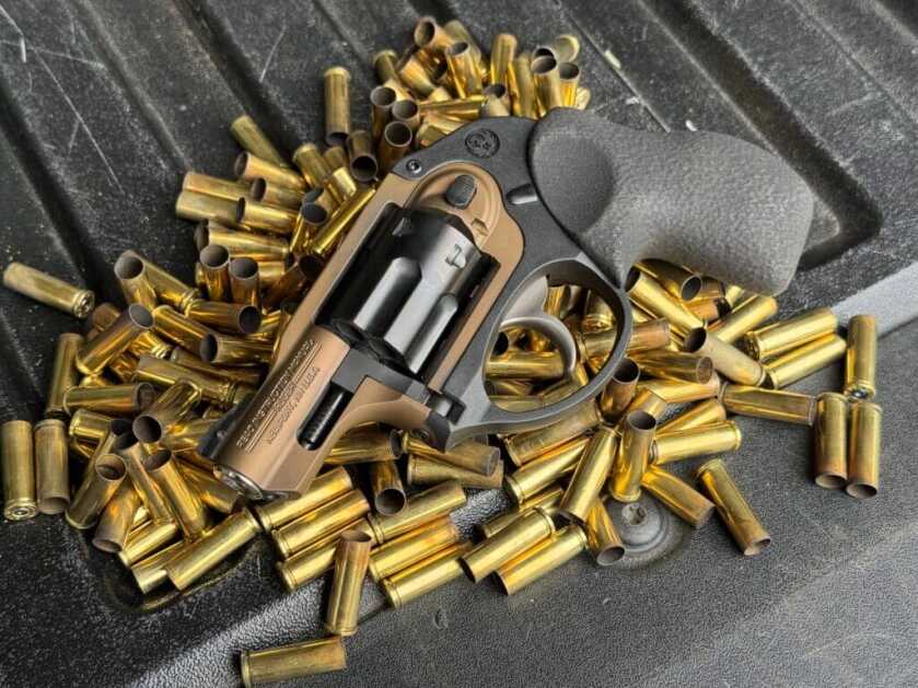 LCR and Brass - second-hand gun on pile of brass casings