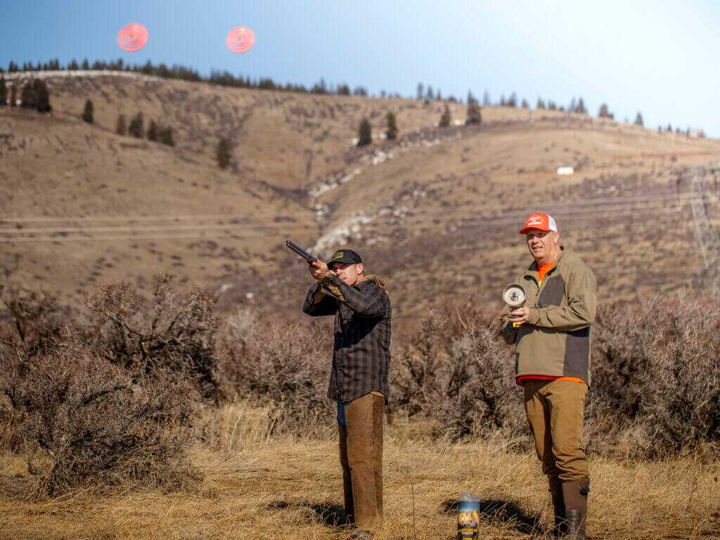 two men shooting at ClayCopter pigeons