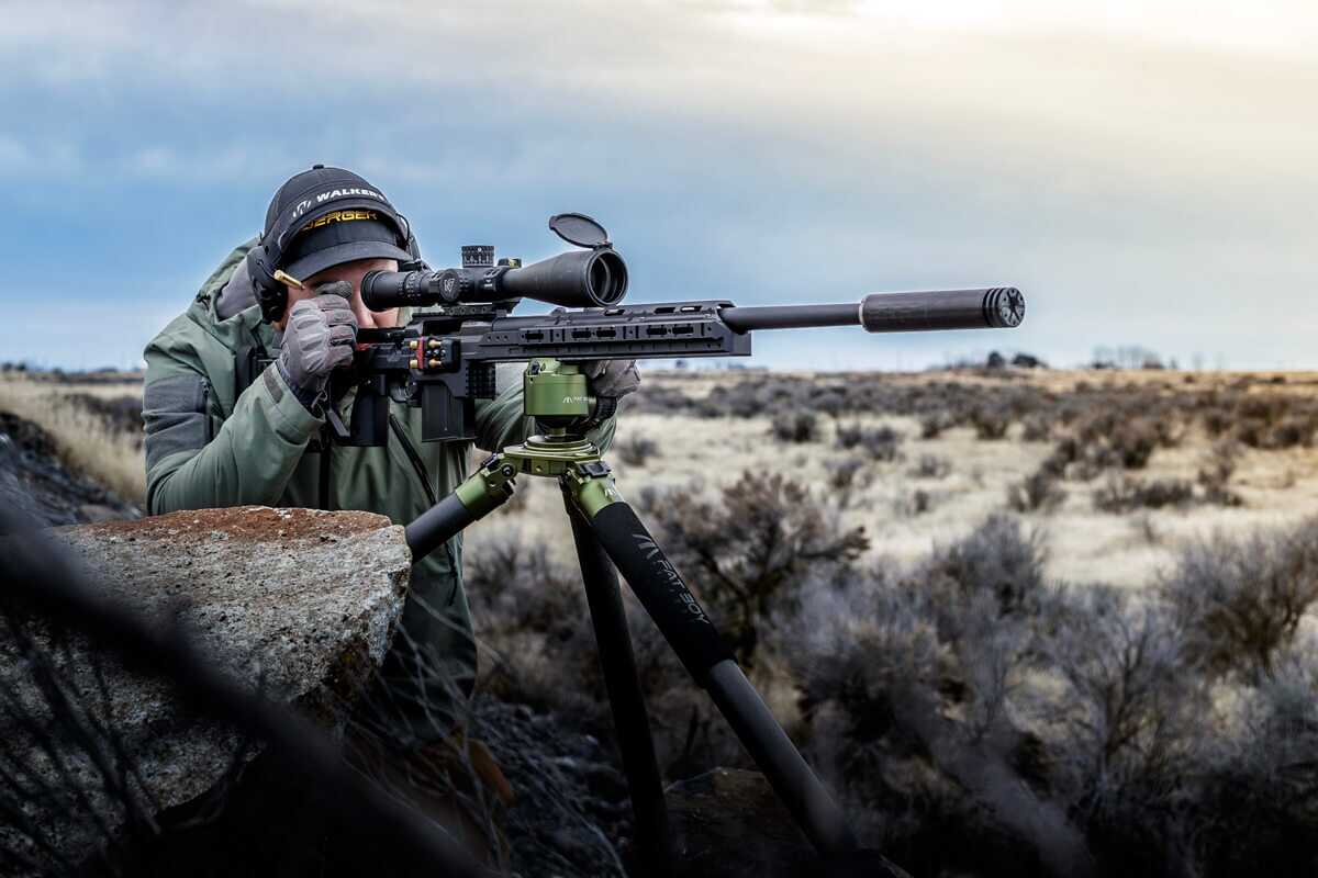 Shooter behind a rifle in a KRG C-4 chassis on a tripod, best overall rifle chassis 2026