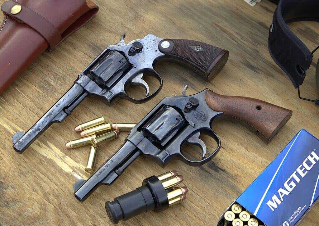 Two revolvers on floor with Magtech ammo