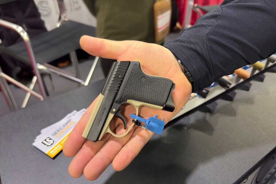 A Seecamp pocket pistol in the hand.