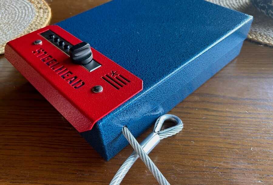 Close-up of lock box and cable connected through the side loop.