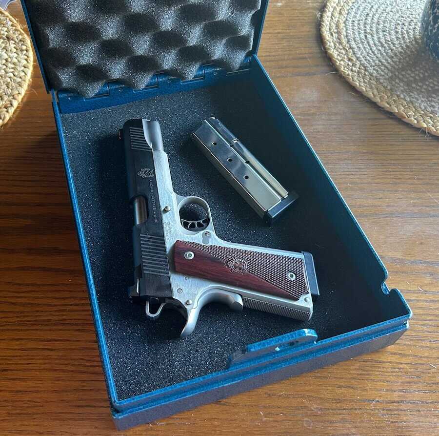 Springfield Armory Ronin 1911 in 10mm inside open Steelhead lock box with spare magazine.