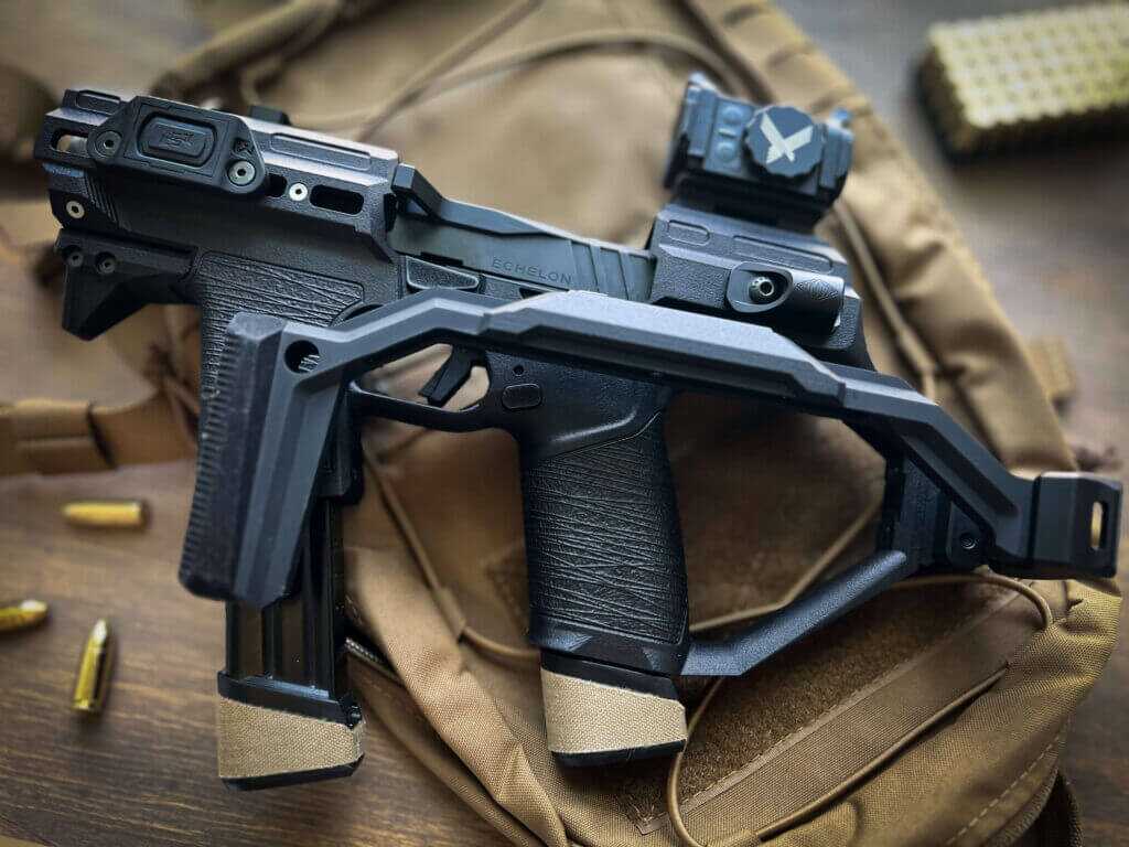 Heighth Defense HGM724 Echelon PDW Chassis sitting on a coyote tan backpack.