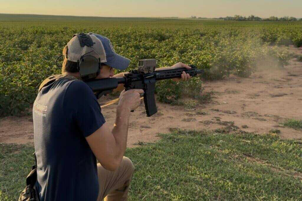 man shooting gun