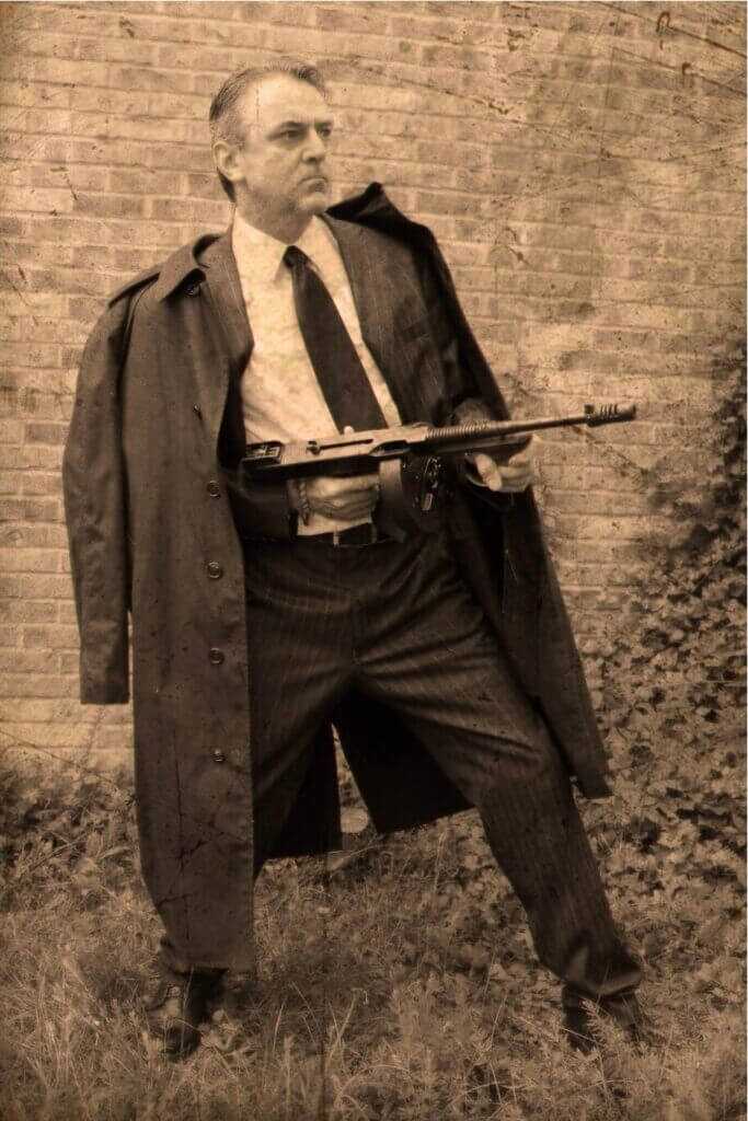old man with a gun