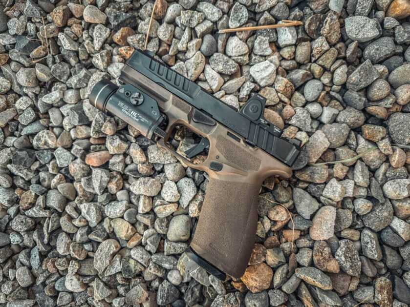 gun on rocks