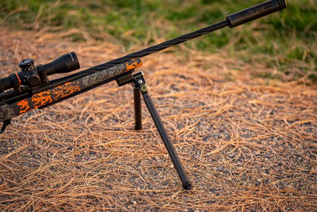 Rifle on ground with CKYE-POD Hybrid using R3D carbon legs for extended height