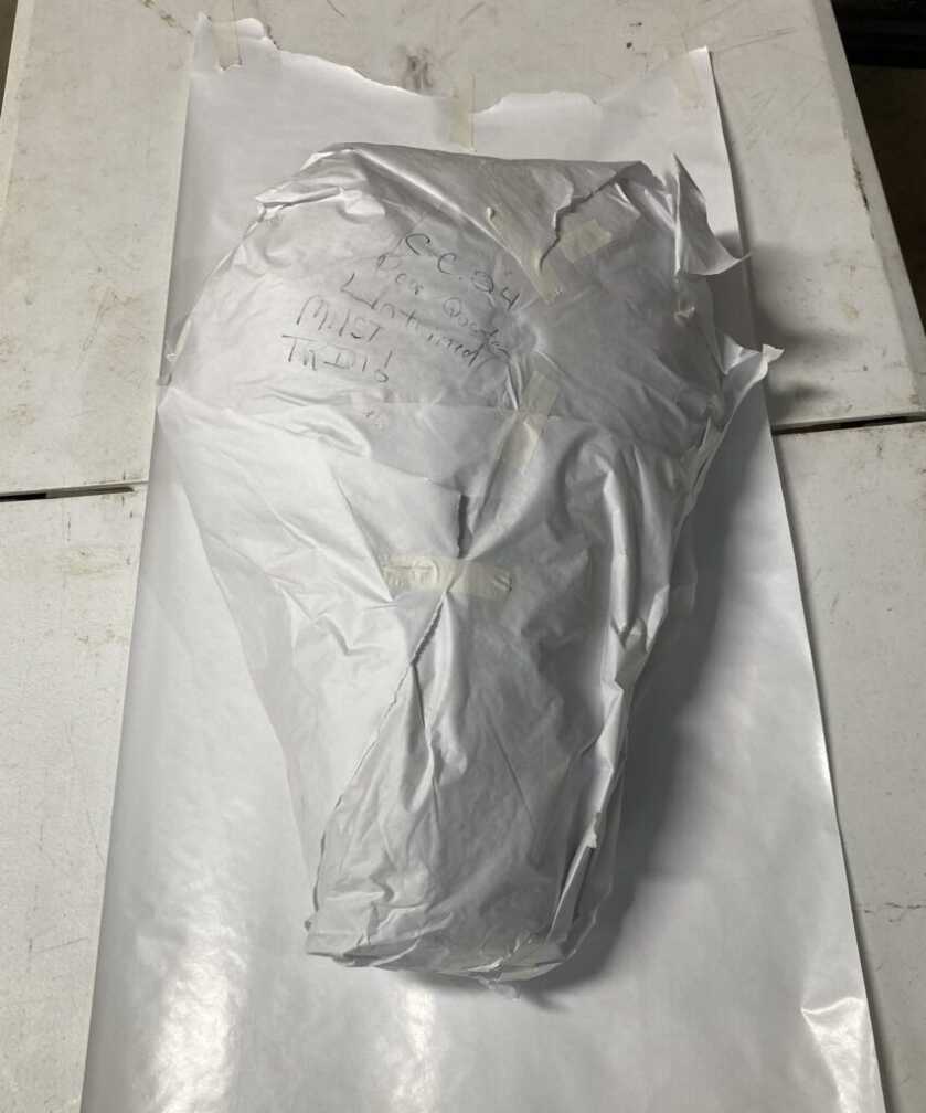 Whole rear elk quarter wrapped in plastic before butcher paper for Traeger cook