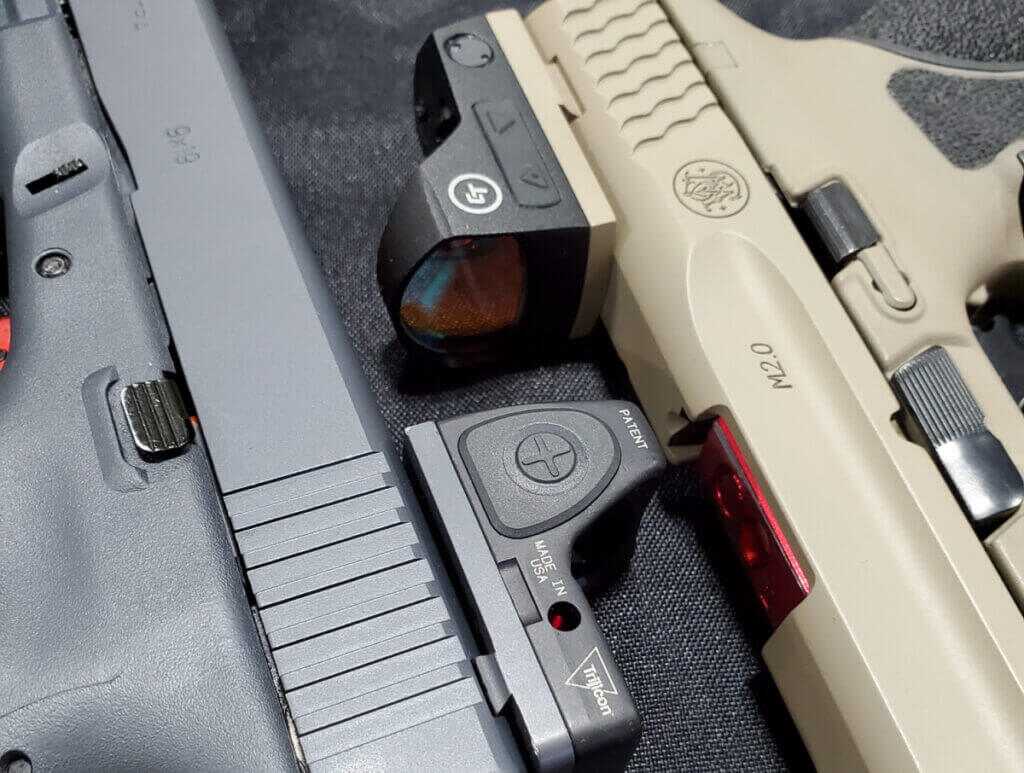 handguns with mounted red dot optics on the firing line