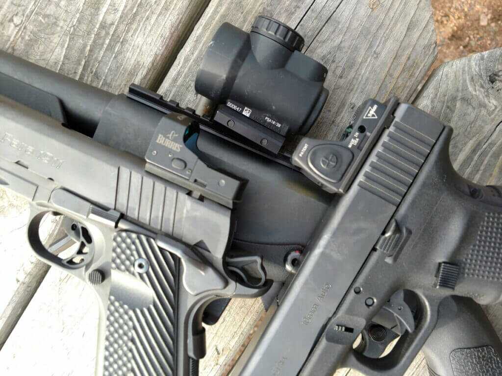 multiple red dot sights on handgun shotgun and rifle examples