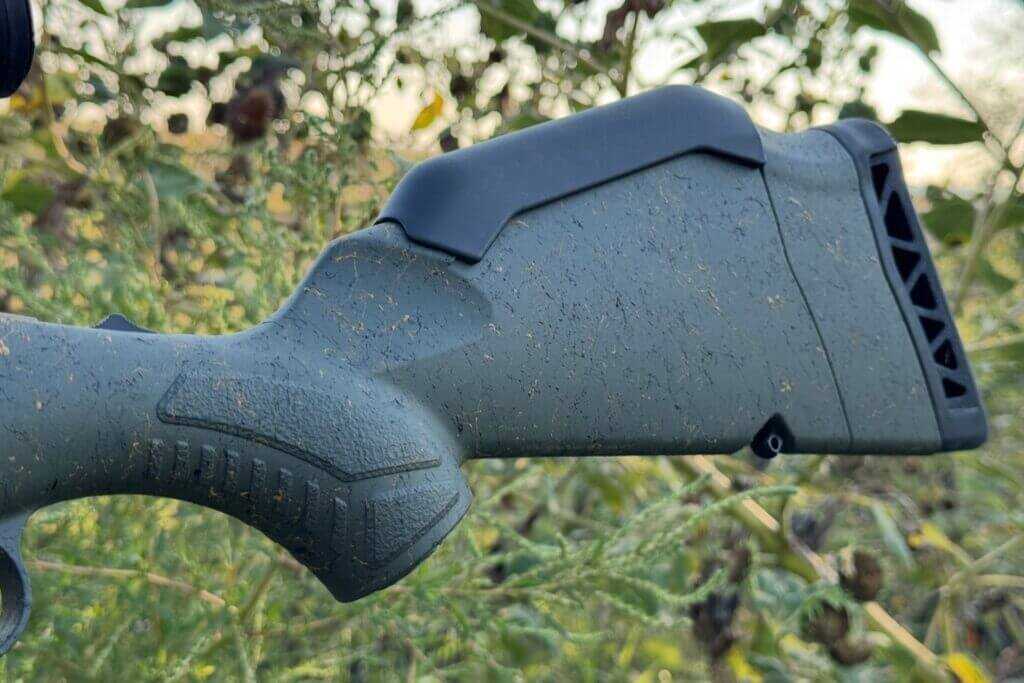 Green splatter stock on the Ruger American Gen II Predator showing raised texture for grip