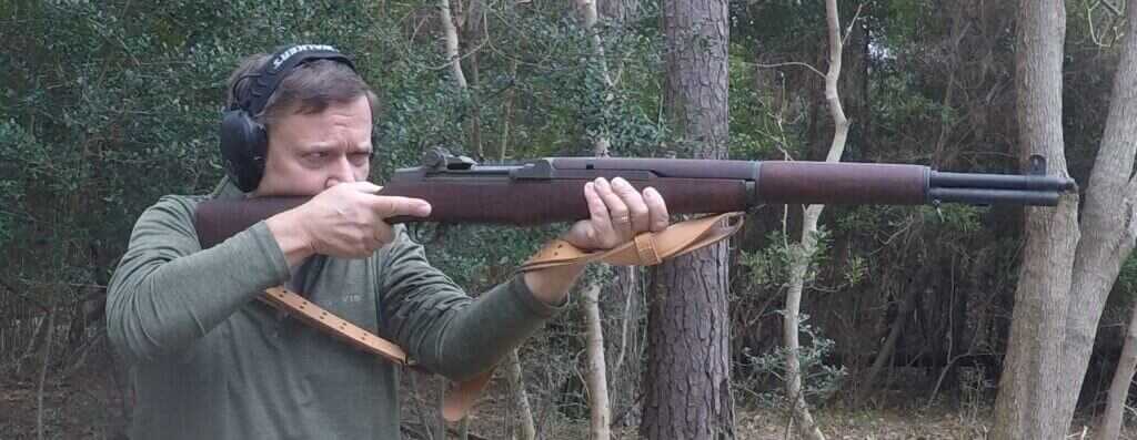 Shooter wrapped into M1 Garand sling firing from supported position