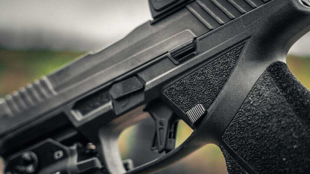 Taurus TX9 controls showing ambidextrous slide release and magazine release
