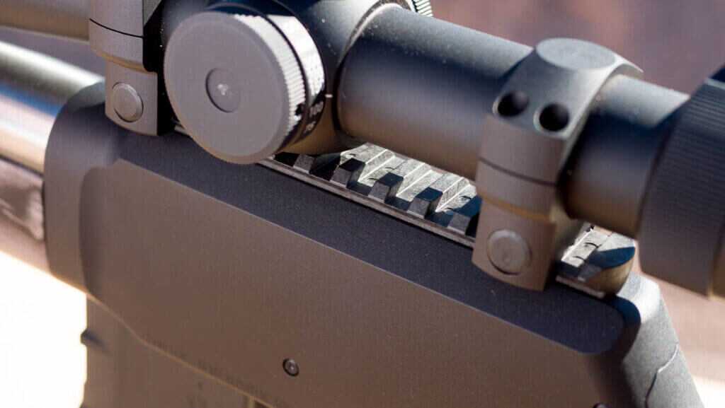 close up of the picatinny rail with an optic mounted.
