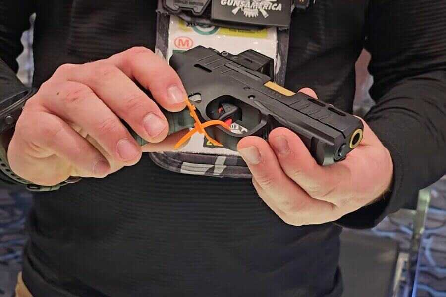 A Bersa BP13 in the hands.