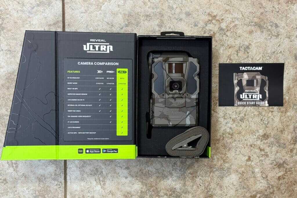Tactacam REVEAL Ultra cellular trail camera kit with mounting strap and quick start guide