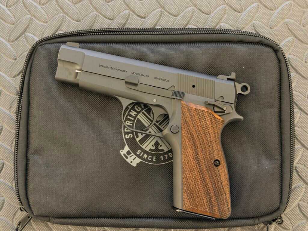Springfield Armory SA-35 4-inch compact Hi Power profile on display, showing the shortened slide and classic steel-frame lines