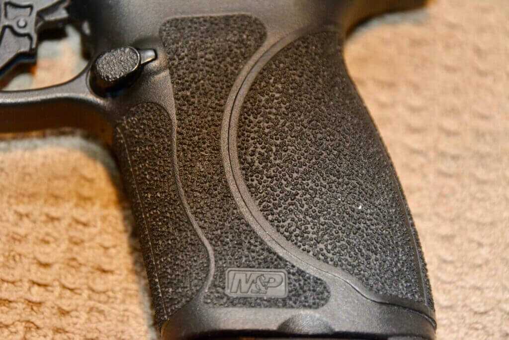 Smith & Wesson M&P 2.0 grip texture close-up showing improved stippling for control without harsh carry discomfort