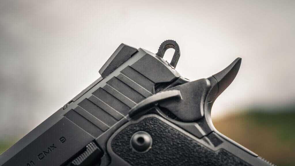 Ambidextrous thumb safety paddles on the EAA Witness2311 CMXX with smooth edges