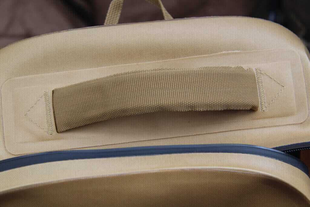 Durable top grab handle on Dive Bomb Waterproof Zip Backpack for blind or tree hanging